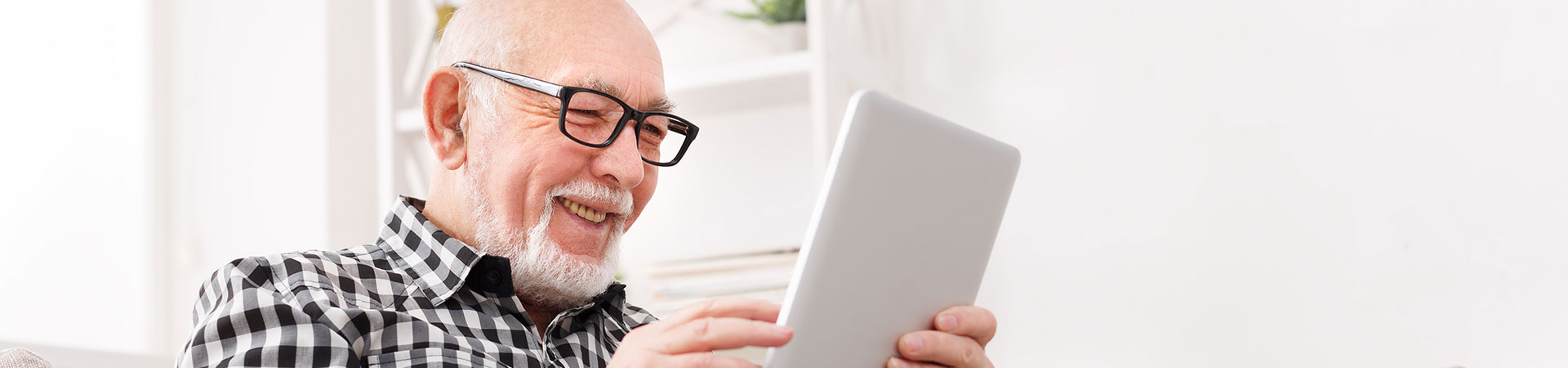 senior man on a tablet